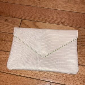 5/$3 Ipsy bag in cream with button closure